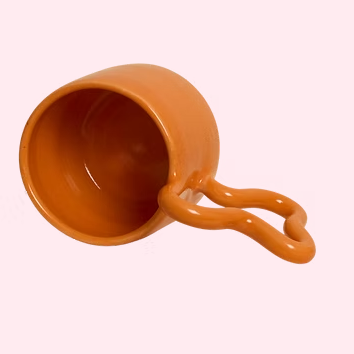 Orange ceramic mug on a white background
