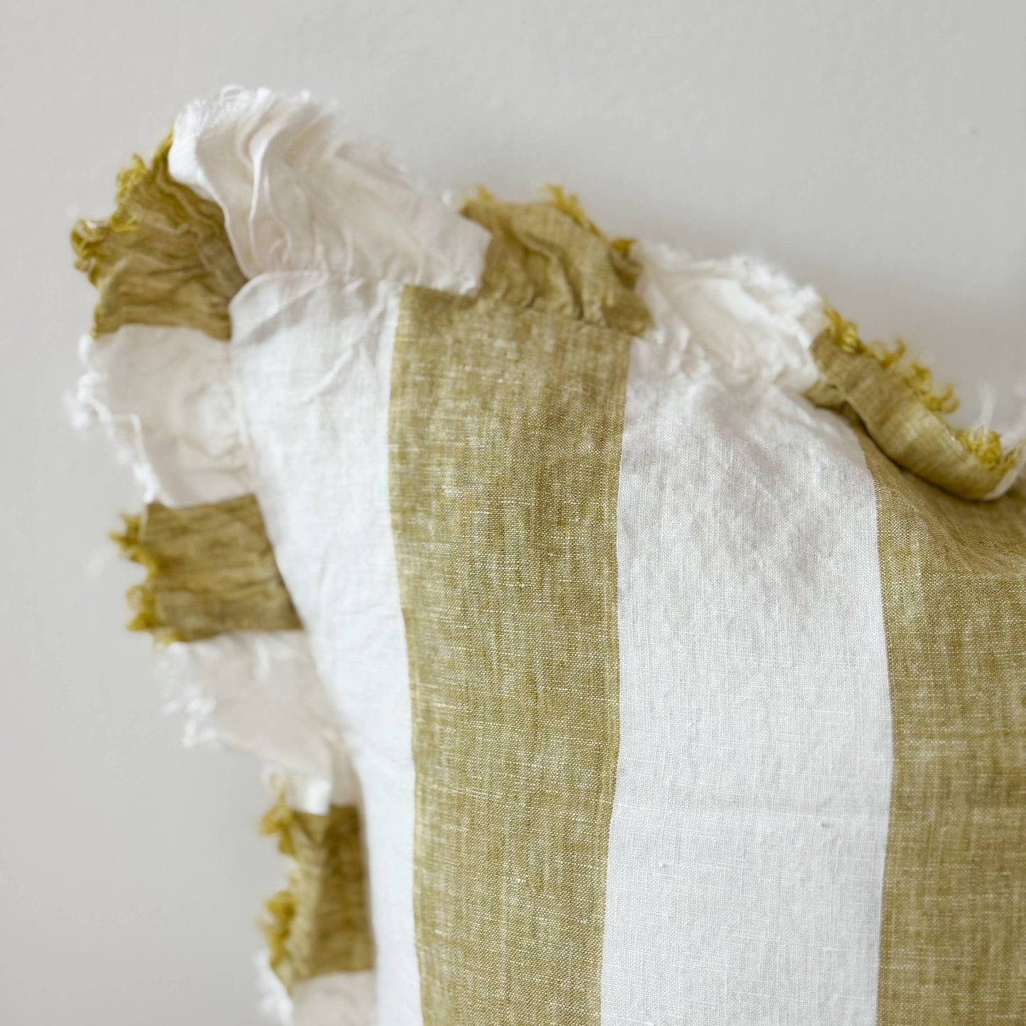 Textile with green and white pattern on a plain background