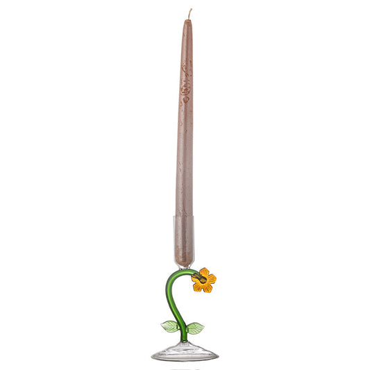 Decorative candle holder with a flower design on a white background