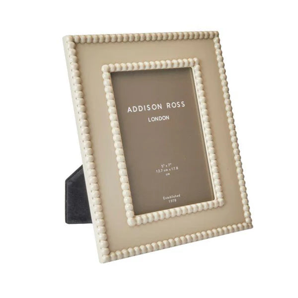 Beige photo frame with Addison Ross branding on a white background