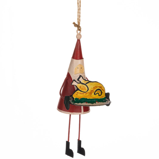 Decorative Christmas ornament of a Santa Claus figure holding a turkey, hanging from a string on a white background.