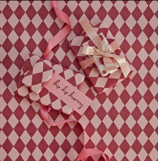 Presents and cards displayed on a shelf
