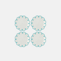 Four round ceramic plates with turquoise rim on a white background