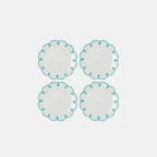 Four round ceramic plates with turquoise rim on a white background