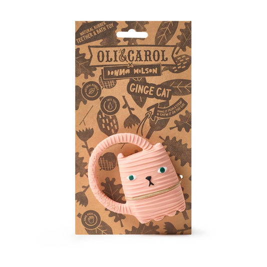 Pink cat-shaped toy with 'Oli & Carol' branding on a brown package.