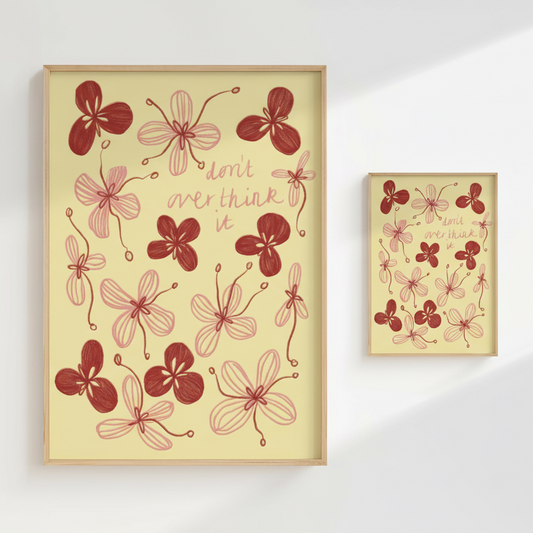 Framed artwork with red floral patterns and text on a beige background