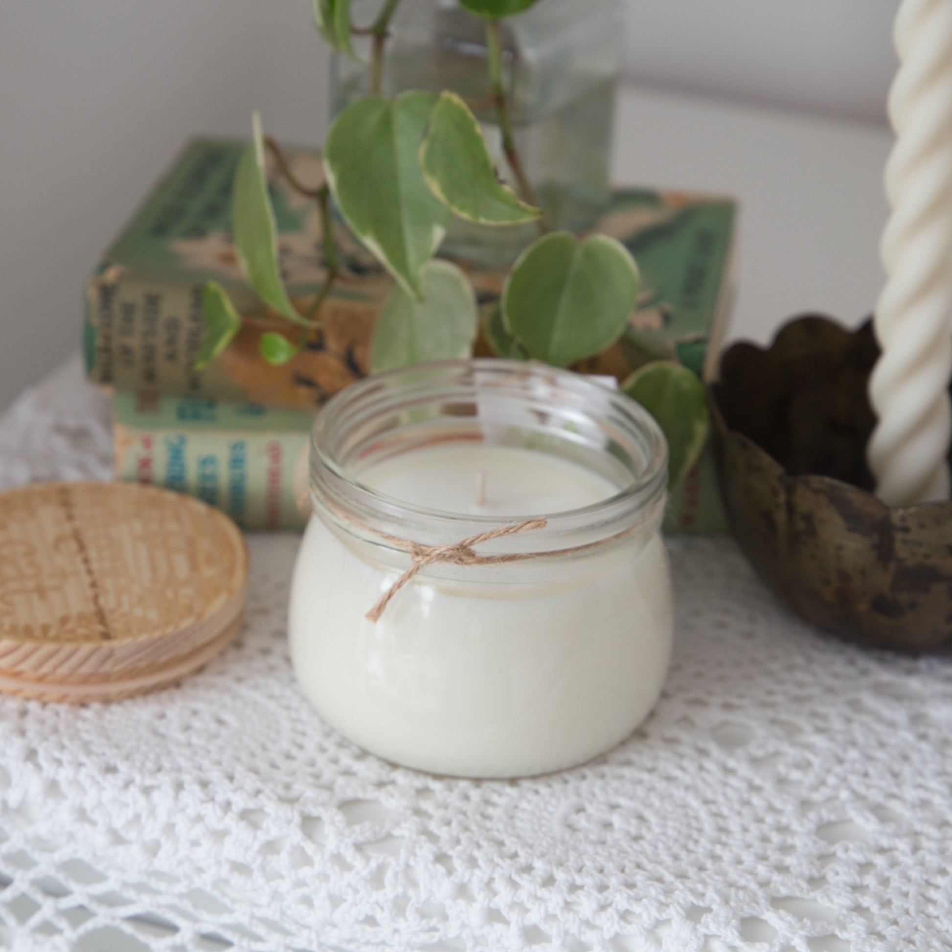 Styled shot of Agnes and car Small Kilner Jar Candle with lid off 