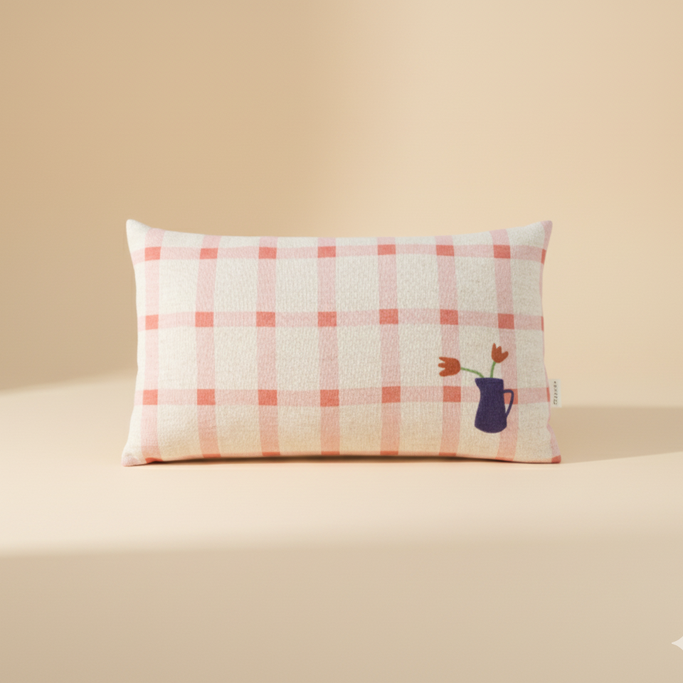 Checkered pillow with floral embroidery on a beige background