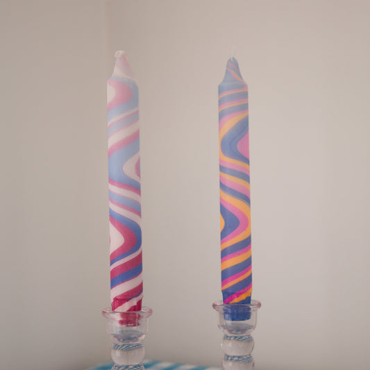 Nordtrice marble taper candles displayed in glass candle holders 