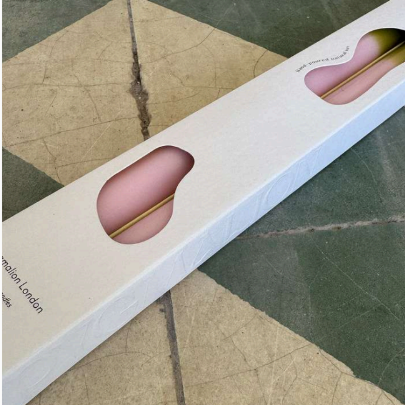 Pygmalion Dinner Candles Green Pea front packaging with candles peaking through 