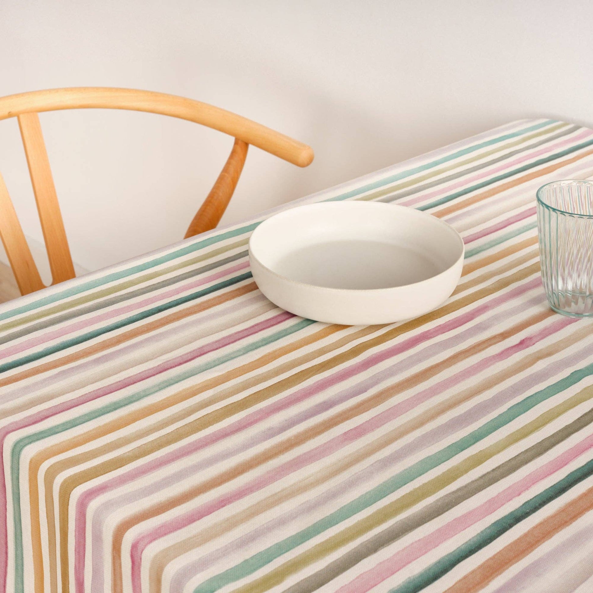Striped Tablecloth waterproof and stain resistant handmade in spain displayed on a kitchen table