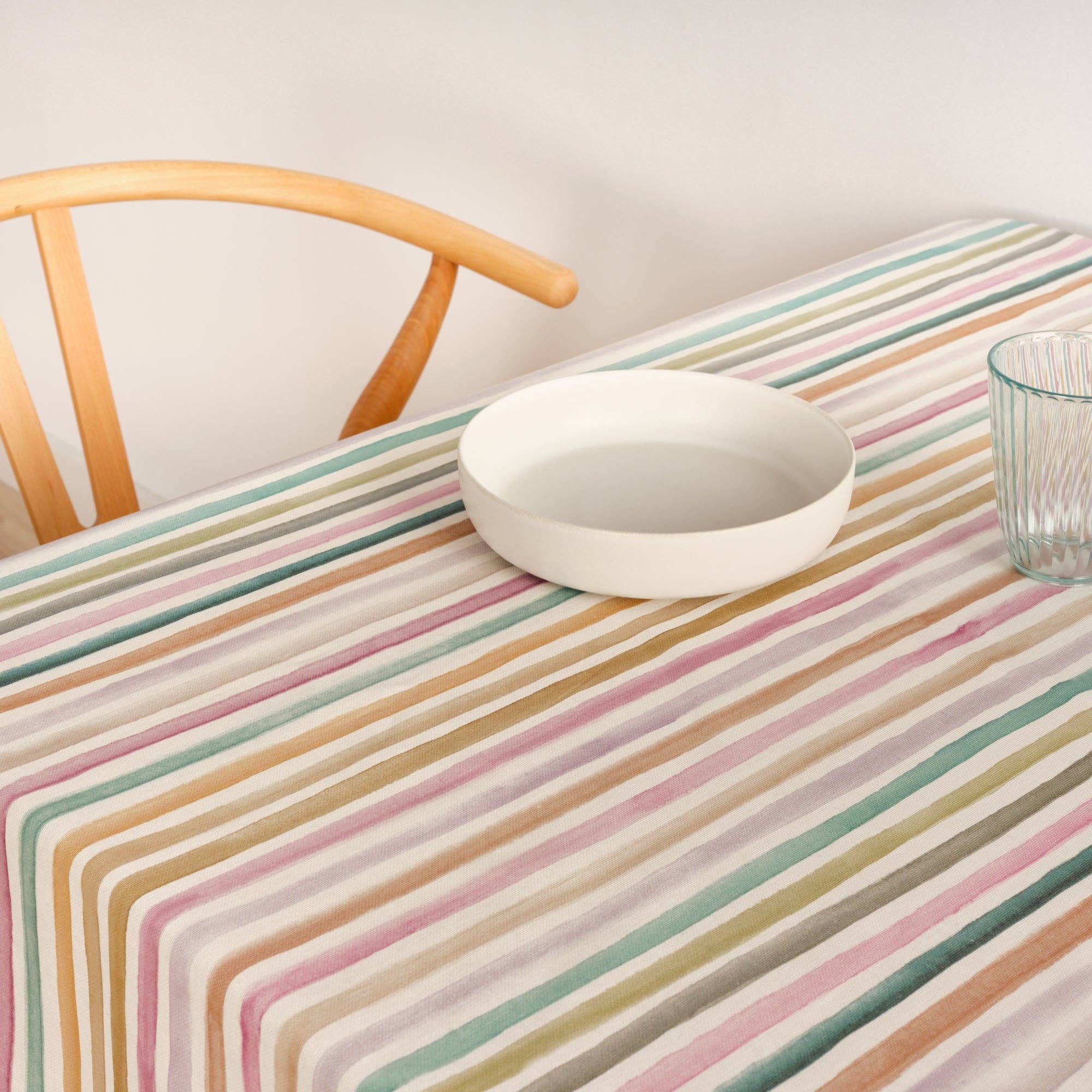 Striped Tablecloth waterproof and stain resistant handmade in spain displayed on a kitchen table