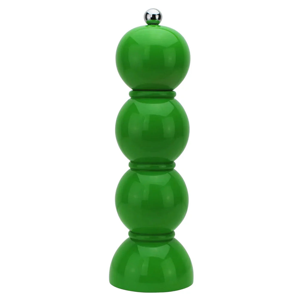 Green pepper grinder on a white background