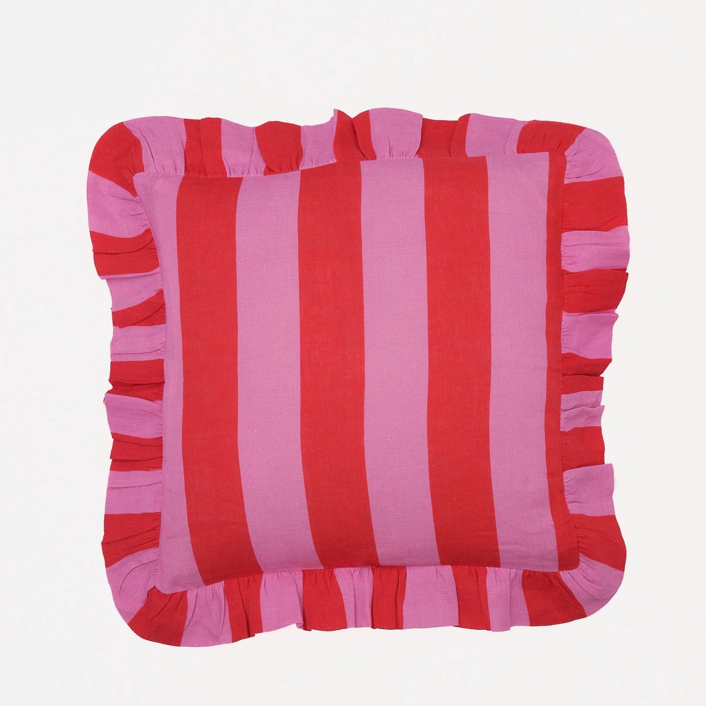 Red and pink striped pillow with ruffled edges on a white background