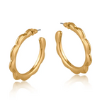 Gold hoop earrings on a white background