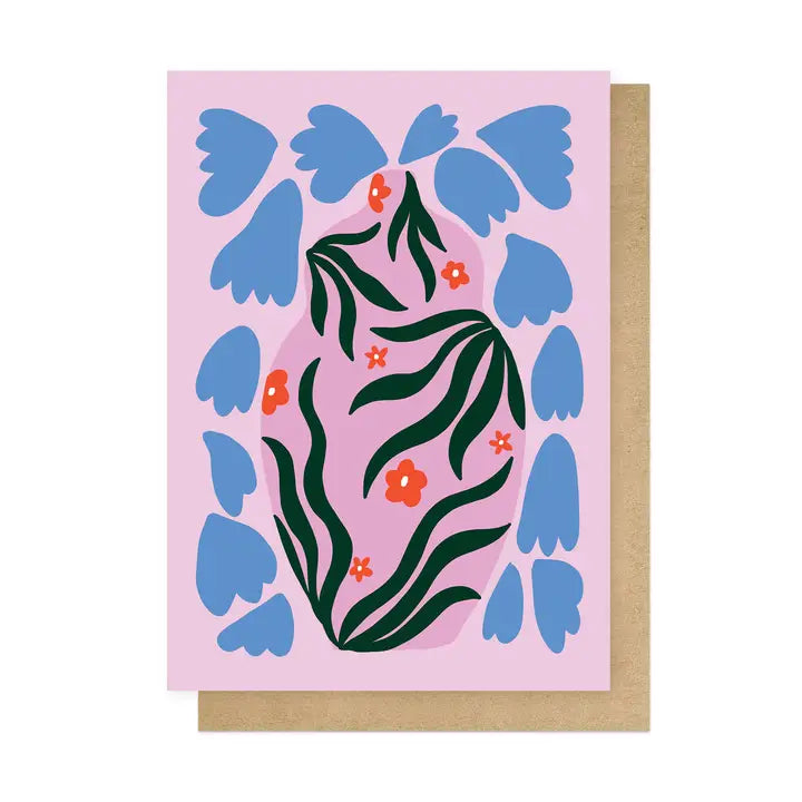 Greeting card with blue floral design on a pink background