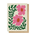 Card with pink flowers and green leaves on a beige background