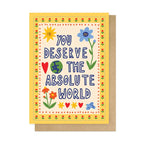 Greeting card with colorful text and illustrations on a white background