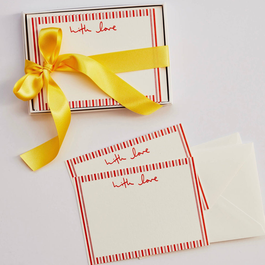 Note cards with red stripes and 'with love' text, tied with a yellow ribbon on a white background.
