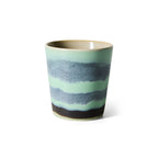 Ceramic mug with striped design on a white background