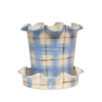 Ceramic planter with plaid pattern on a white background