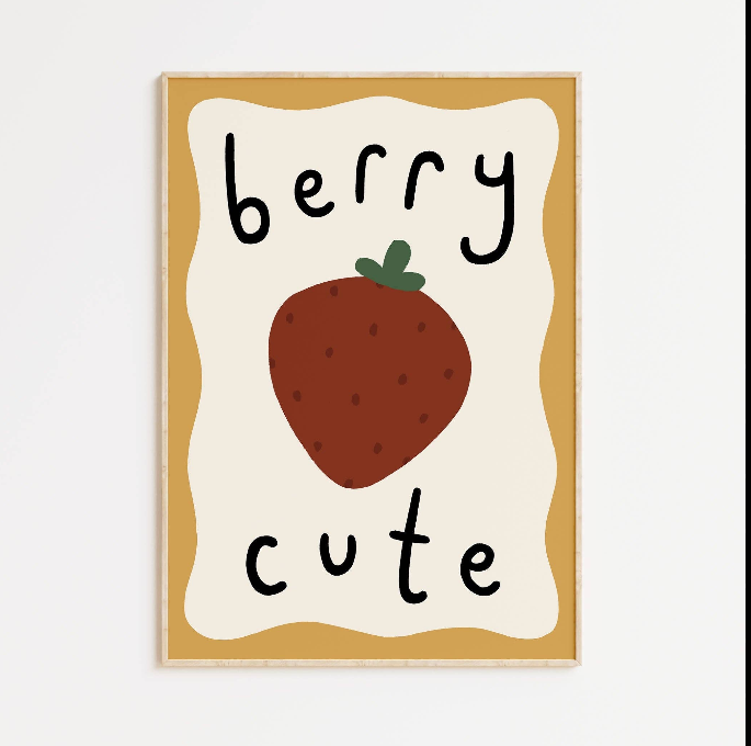 Framed artwork with a strawberry and 'berry cute' text on a white background