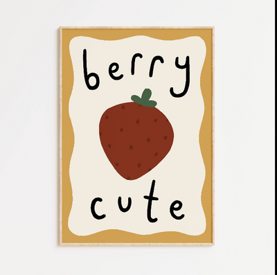 Framed artwork with a strawberry and 'berry cute' text on a white background