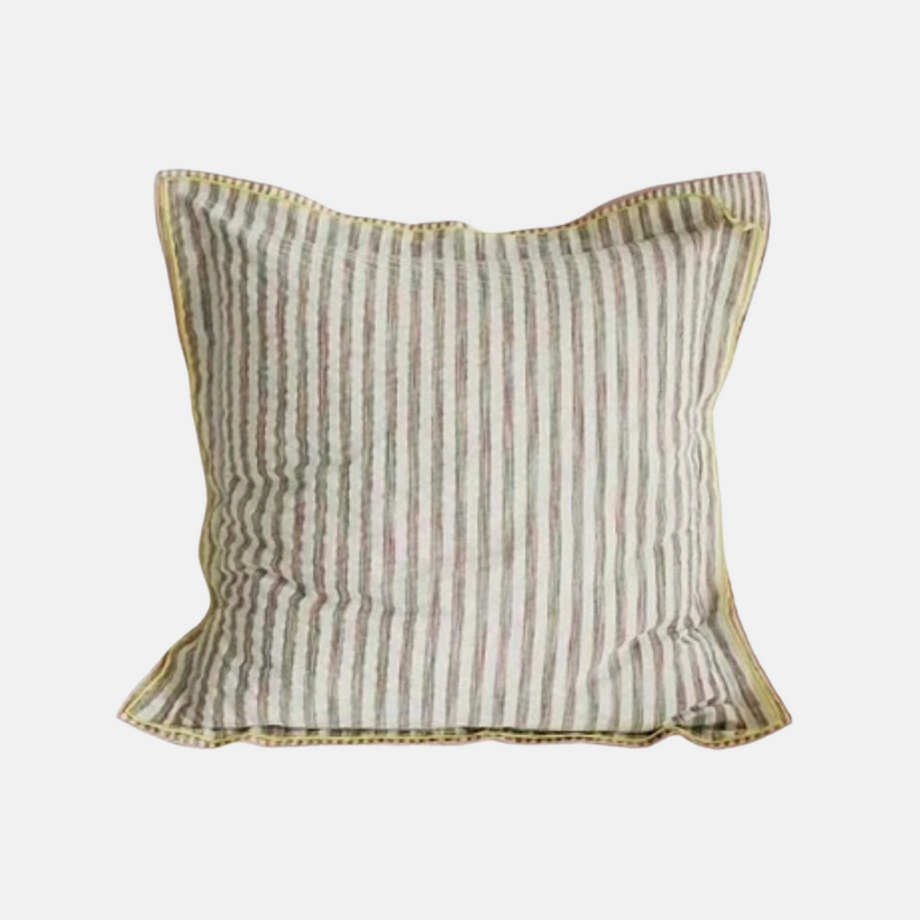 A square decorative throw pillow with vertical stripes in muted beige, olive green, and soft pink, finished with a gold-toned piped edge, shown against a plain light gray background.