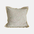 A square decorative throw pillow with vertical stripes in muted beige, olive green, and soft pink, finished with a gold-toned piped edge, shown against a plain light gray background.