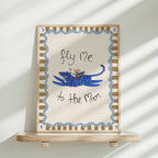 Framed artwork with a blue tiger and text 'fly me to the moon' on a white background
