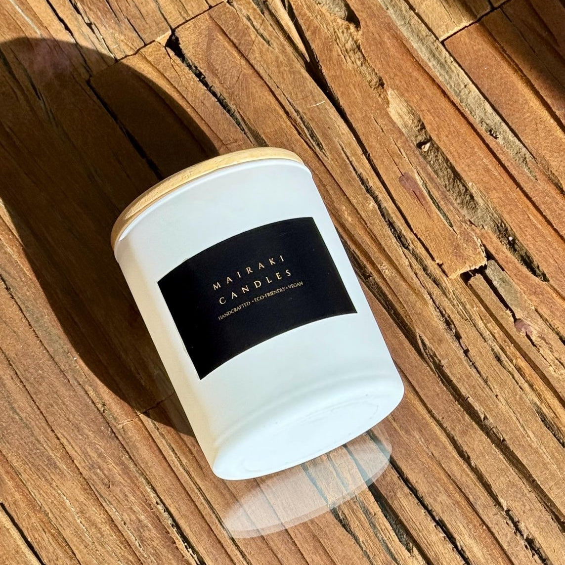 White jar candle placed on a wooden top