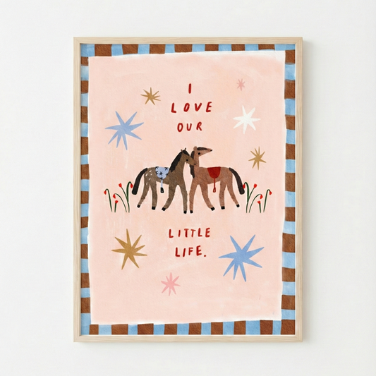 Framed artwork with two horses and text on a pink background