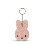 Pink bunny keychain on a white background