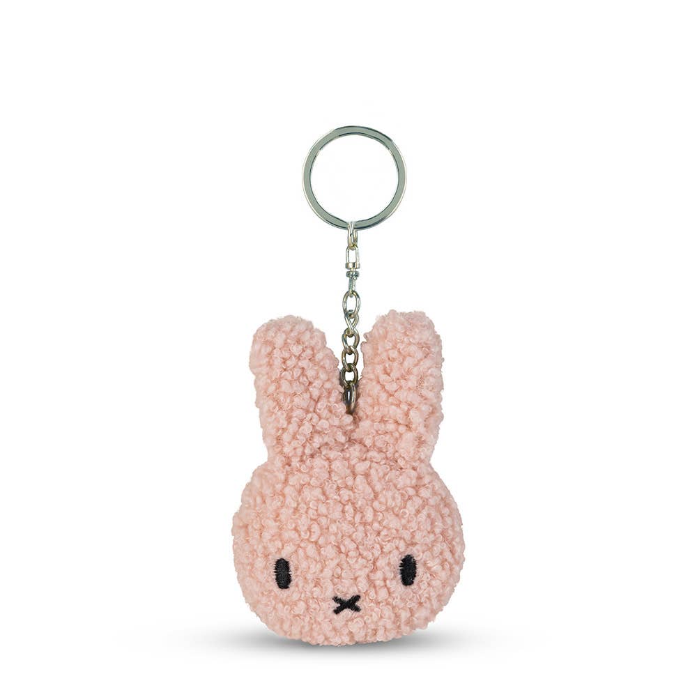 Pink bunny keychain on a white background