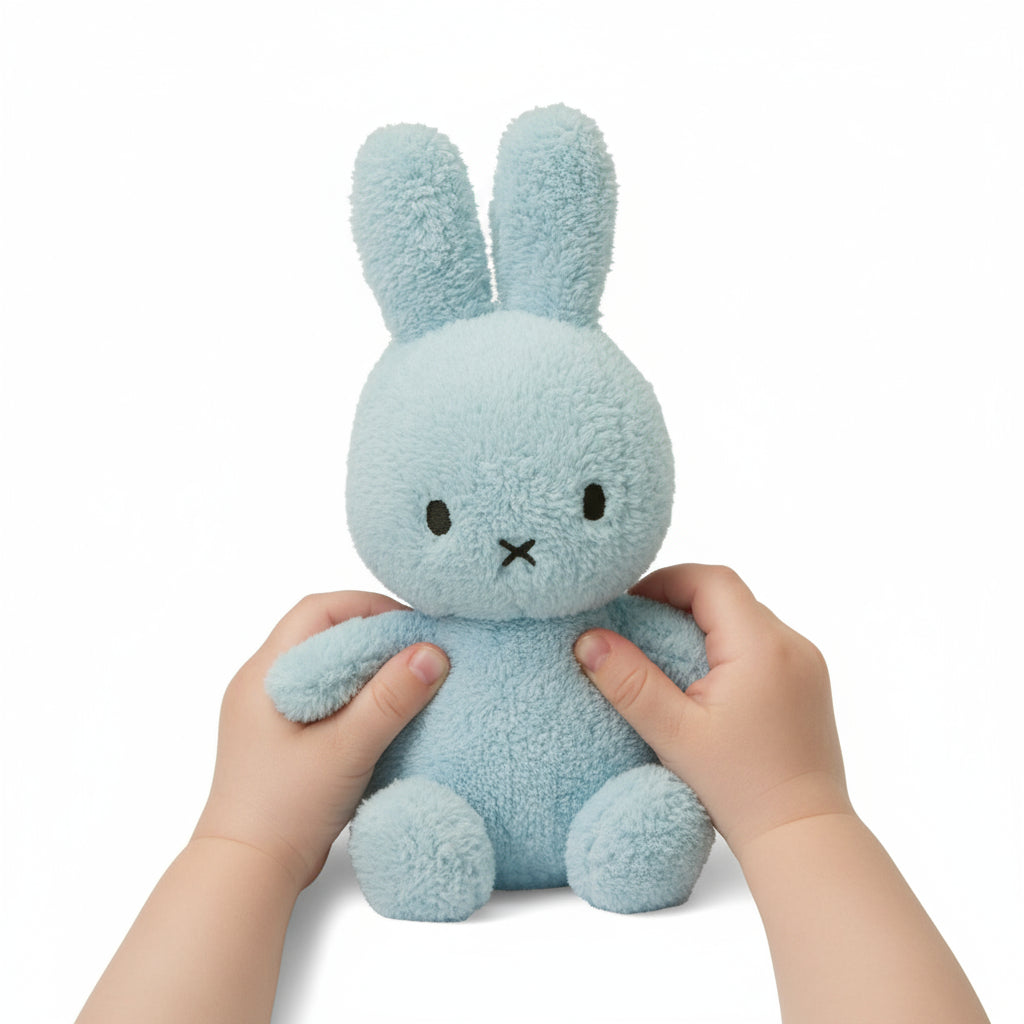 Blue plush bunny toy on a white background