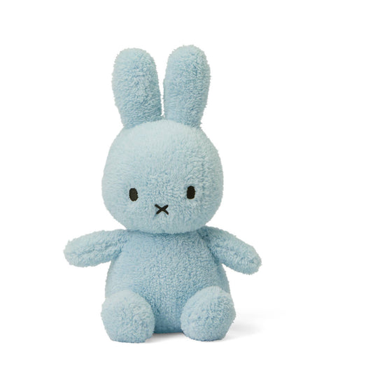 Blue plush bunny toy on a white background