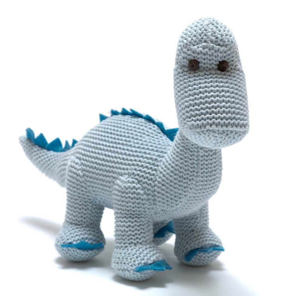 Knitted dinosaur toy with blue accents on a white background