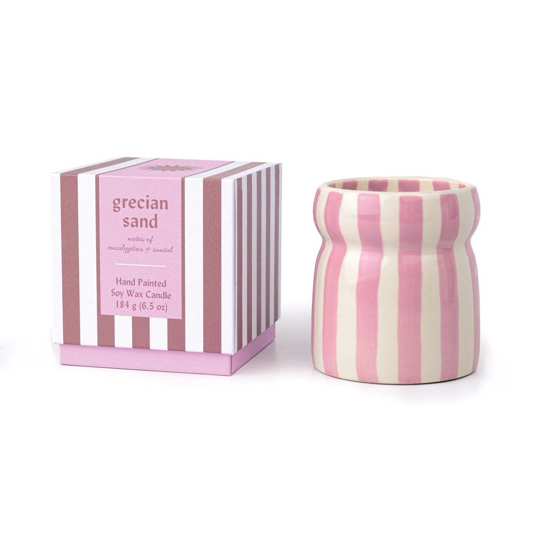Pink and white striped candle with matching box on a white background