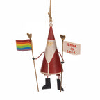 Decorative figure of a Santa Claus holding a rainbow flag and 'Love is Love' sign on a white background.