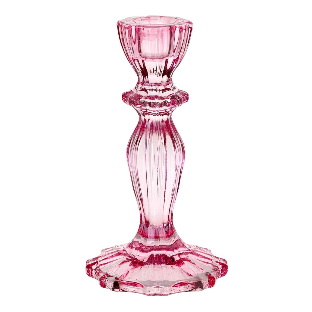 Pink glass candle holder on a white background
