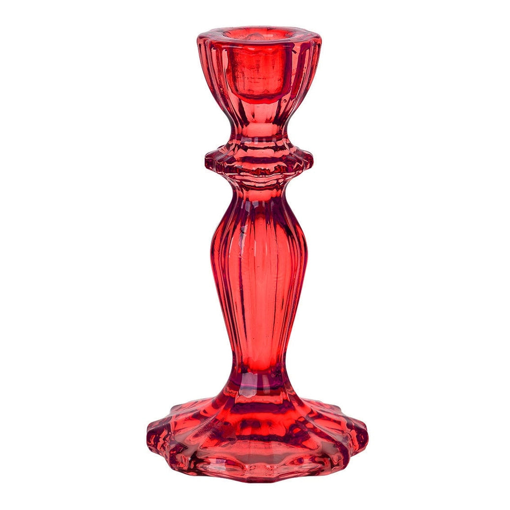 Red glass candle holder on a white background