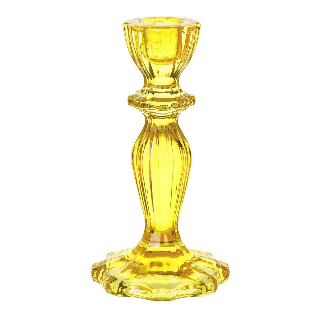 Yellow glass candle holder on a white background