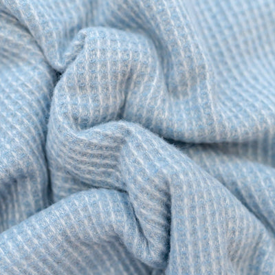 Close up picture of the azure blue waffle blanket