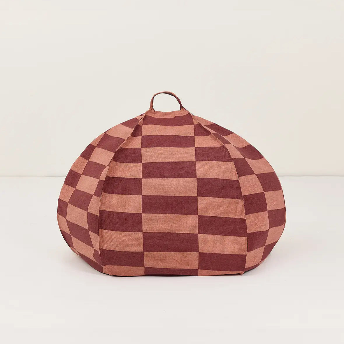 Checkered bean bag chair with a brown and pink pattern on a white background